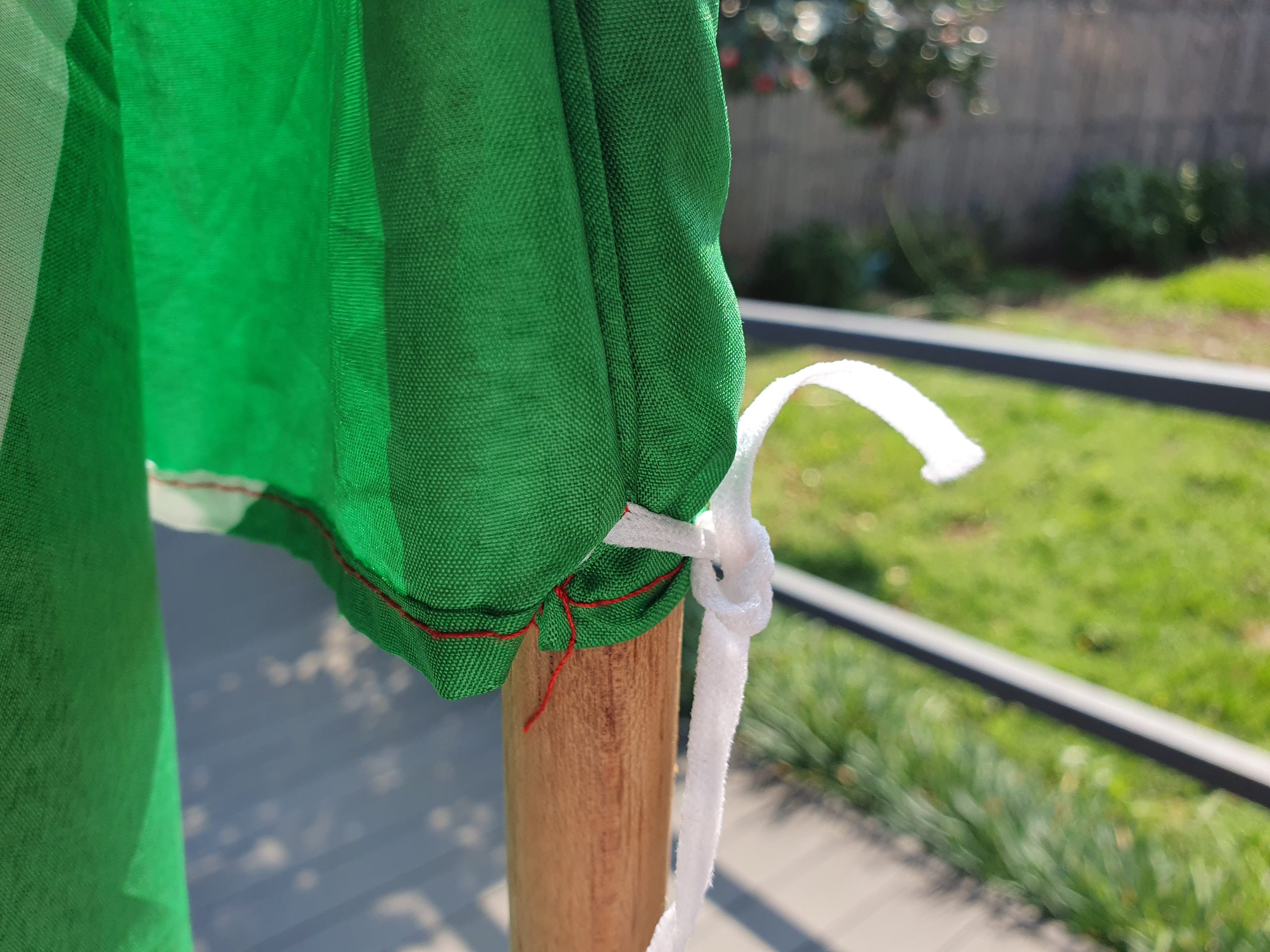 Close-up of the flag sleeve and tie-down secured around a flag stick