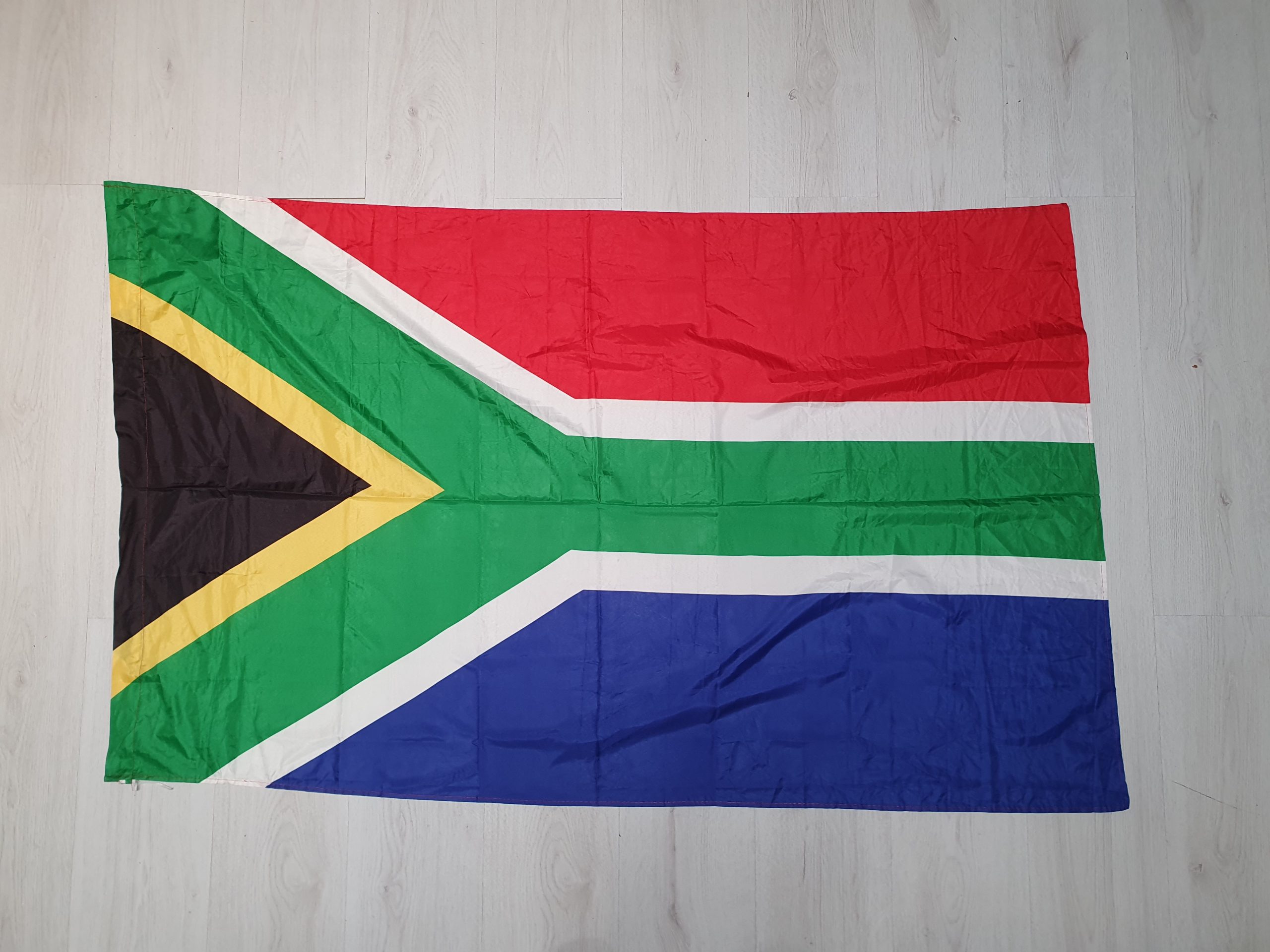 South African flag laid flat, showing the full flag design